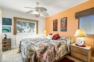 Bedroom featuring a King bed and TV with Ocean views