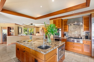 Gourmet kitchen with granite counters, premium appliances, and a generous island—perfect for entertaining or chef-prepared meals.