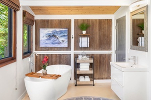 Indulge in the spa-like bathroom with a soaking tub, natural textures, and modern design.