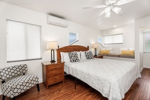 Unwind in your peaceful bedroom with crisp linens, warm wood floors, and modern comfort. Air conditioning keeps you cool while natural light filters through.