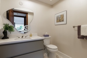 A convenient half bath with a single sink, perfect for guest use.