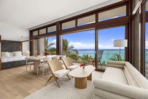 Cozy and contemporary living area with floor-to-ceiling windows that bring the outdoors in.