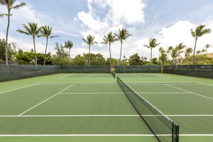 Tennis courts with palm trees and bright skies.