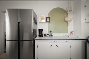 Enjoy a practical kitchen layout with stainless appliances and space for easy meal prep.