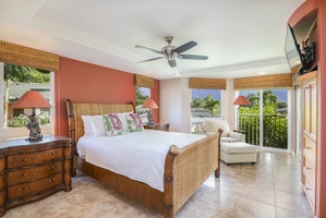 Spacious second guest suite with a king bed and outdoor access.