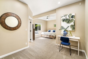 Downstairs primary bedroom equipped with King bed, A/C, TV, and ensuite