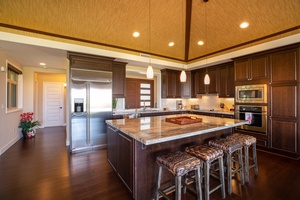 Large, open kitchen with stainless steel appliances