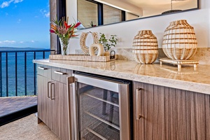 Kaanapali Shores 702's kitchen includes a wine fridge—perfect for chilled sunset sips.