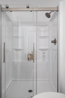 Dual-entry standing shower offers convenience and comfort for multiple guests.