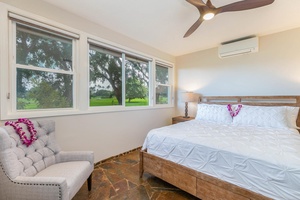 The downstairs guest bedroom with king bed and, split AC and large flat-screen TV.