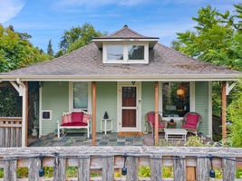 Begin your day on this delightful front porch, sipping coffee while soaking in the garden's tranquil atmosphere.