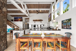 Share meals and moments around a vibrant table, just steps from the open kitchen.