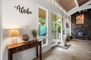 Arrive to a warm welcome, where open doors lead to lush tropical greenery.