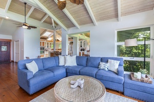 The vaulted ceilings and beams, combined with the abundance of natural light, create an open and airy ambiance.
