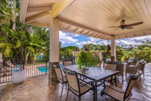 Another shaded dining area at Pohaku Villa with tropical garden and pool views.