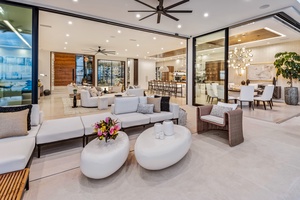 Walls of glass invite light and views, creating a perfect space for relaxing or entertaining.