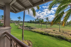 Private lanai with sweeping views of lush greenery and swaying palms, perfect for morning coffee or evening relaxation.
