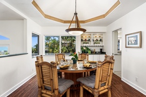Gather around this elegant dining table for memorable meals with tropical views framing your conversations.