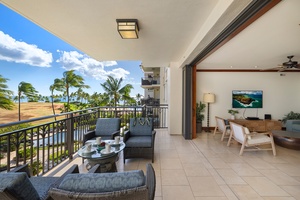 Relax on your private balcony with stunning tropical views, then step inside to unwind in your elegant living space.