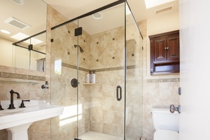 The pool area bathroom includes a large shower