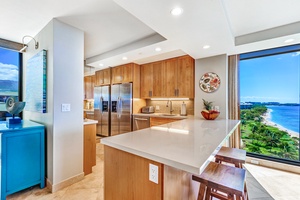 Share stories or sunset bites at the cozy kitchen bar for two inside Mahana 1119.