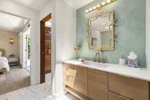 Beautiful primary ensuite with expansive vanity and storage