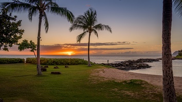 Beach front vacation rental view of a beautiful sunset in the lagoon at Ko Olina.