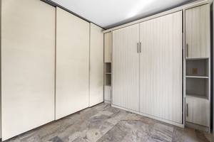 Bonus area with sliding door closing it off from the bedroom
