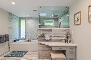 Indulgent private en suite bathroom featuring a soothing jetted tub