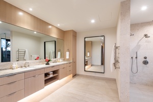 Step into your luxurious spa-like bathroom with sleek modern finishes, rainfall shower, and elegant vanity designed for ultimate relaxation.