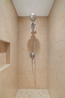 A separate shower on the ensuite bath.