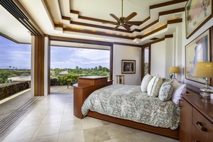 Your luxurious master bedroom opens to stunning tropical views, where you'll wake to paradise beyond floor-to-ceiling windows and unwind in elegant comfort.
