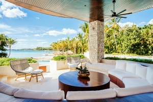 Alternate view of the relaxing outdoor lounge area with stunning ocean views.