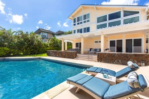 Lounge poolside with a Mai Tai in one hand and a good book in the other!