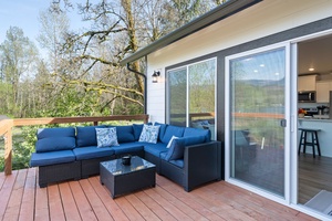 Gather with friends on the outdoor lounge—perfect for sunset chats, cocktails, or stargazing after a day on the lake.