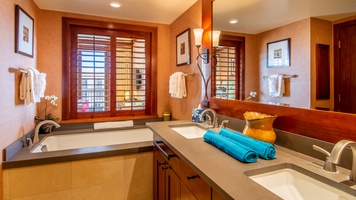 The primary guest bath with a soaking tub and shower.