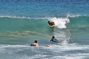 The nearby beach offers perfect waves for boogie boarding and swimming in crystal-clear turquoise waters.