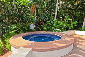 Soak your stress away in this hot tub surrounded by lush tropical gardens and swaying palms.