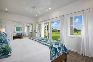 Downstairs guest bedroom 2 with vibrant bedding and panoramic views of the golf course.