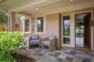 The front entrance provides seating to take off your shoes, or just take a rest, island style.