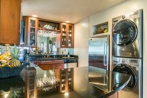 Conveniently prep meals in the fully-equipped kitchen with bar seating for three.