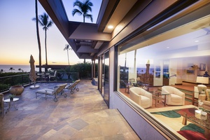 Evening light spills across the lanai, inviting peaceful nights under the stars.