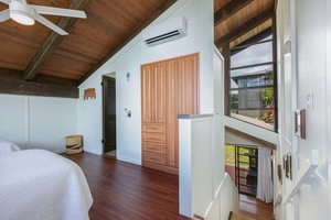 High ceilings, clean lines, and natural finishes define this relaxing king bedroom—your private haven after a day of sun and surf.