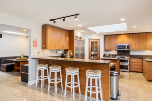 There's breakfast bar seating in the kitchen