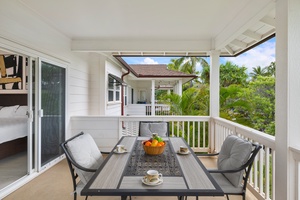 Enjoy meals in a tropical setting in the inviting outdoor patio with a dining set.