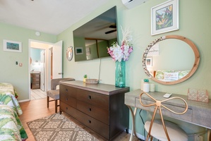 Get ready for the day or take a video call at the convenient vanity-style desk, accented by coastal decor.