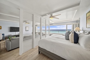 Wake up to endless ocean views from your serene bedroom suite, where crisp white linens and coastal breezes create the perfect retreat.
