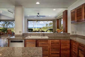 Alternate view of the kitchen facing the lanai and ocean views.