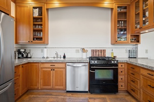 Roomy kitchen area with ample appliances and tools for all your culinary cravings.