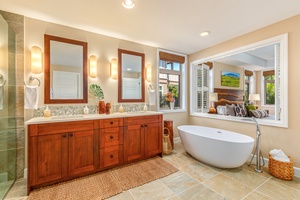 Primary bath with oversized freestanding soaking tub, walk-in shower, dual vanity, W/C and walk-in closet.